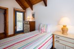 Second floor twin bedroom with access to upper deck
